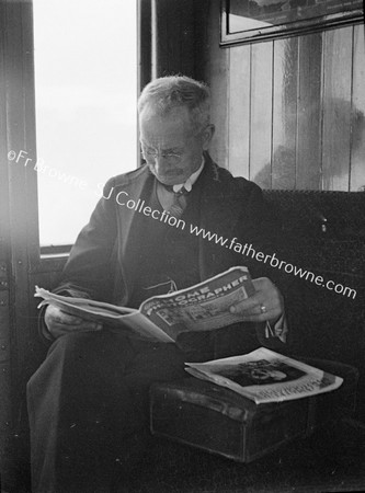 PASSENGER READING 'HOME PHOTOGRAPHER'